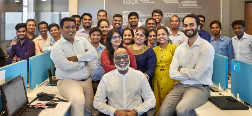 Recruitment team in office working together – representing expert recruiters focused on permanent staffing
