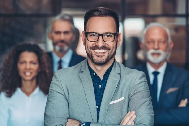Confident business leader smiling – representing successful executive placement
